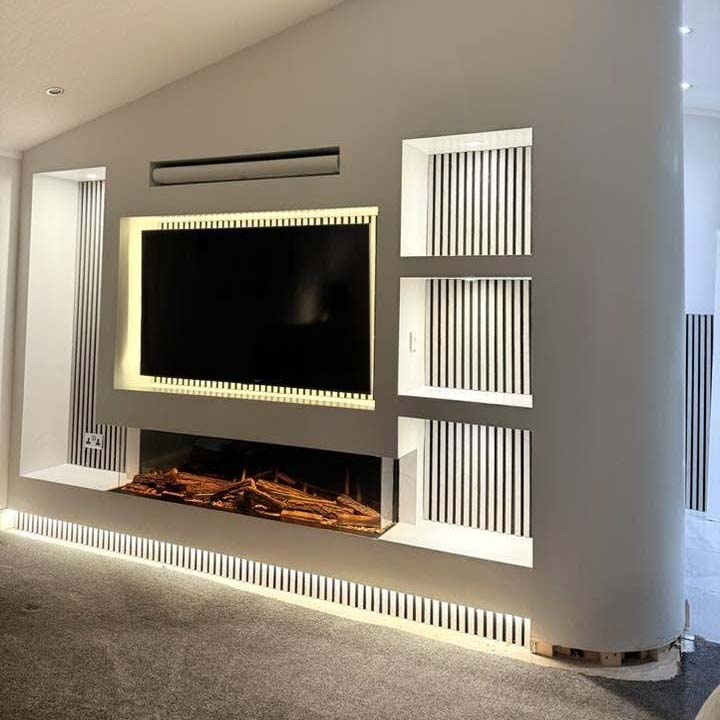 Media Wall with panelling and down lights with fitted TV and soundbar